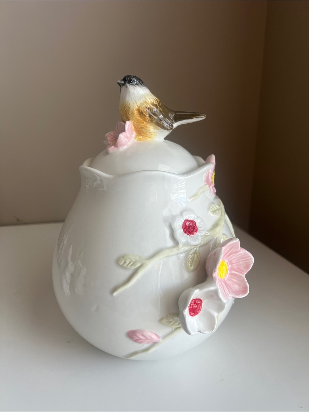 White Porcelain Floral Jar with Perched Bird Lid
